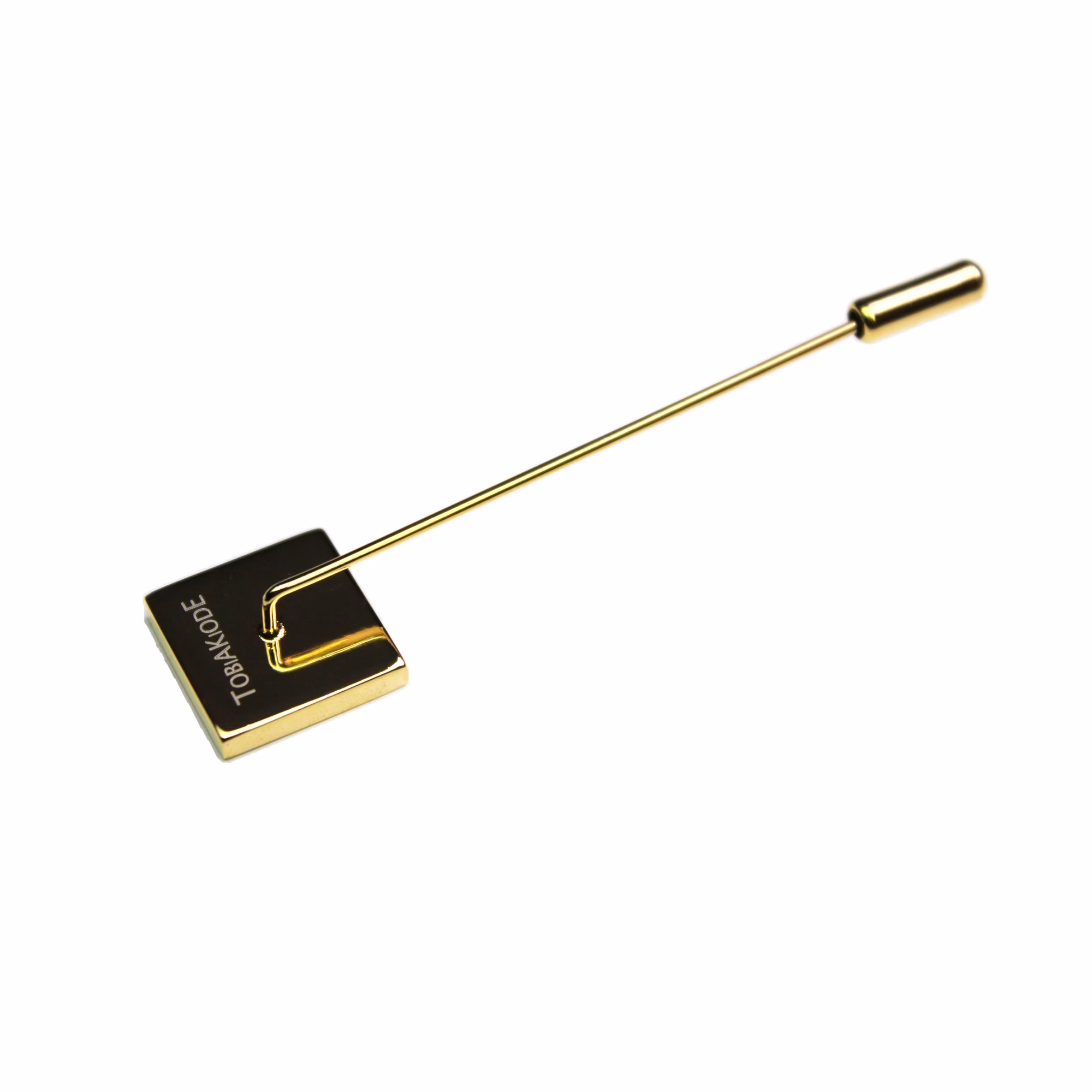 TobiAkiode lapel pin in gold tone with the black-corner geometric logo, reverse fastening view